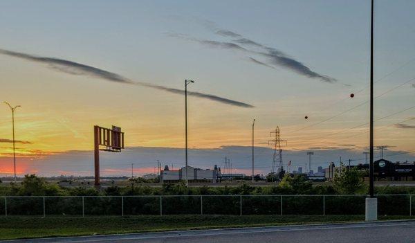 canvas skies at sunset with the St Louis skyline in distance