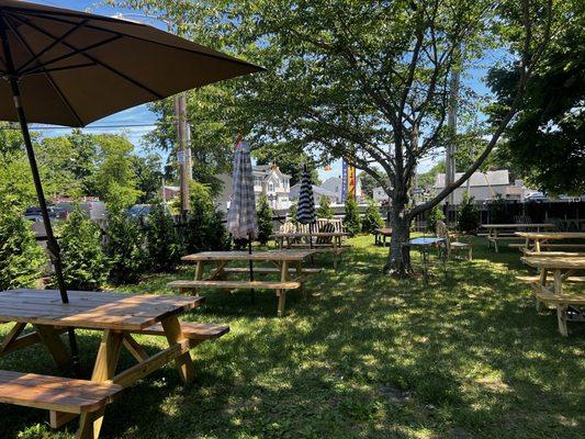 Relaxing Side Yard with Tables 7-3-2024