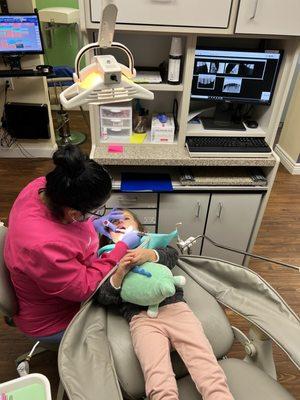 Sandra cleaning my daughters teeth  Great job and great patience Sandra!