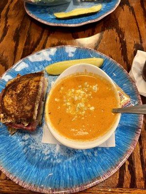 1/2 Reuben sandwich with tomato and corn bisque topped with blue cheese crumbles