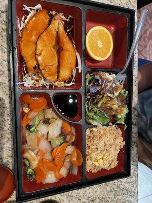 Bento box with baked salmon and veggies