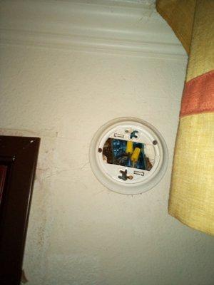 Filthy walls, obvious broken smoke detector