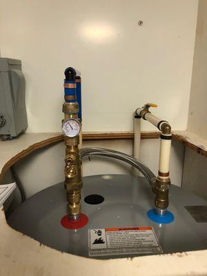 Tank booster, installed to increase hot water production. The 50 gallon heater produces almost as much hot water as an 80 gallon heater.