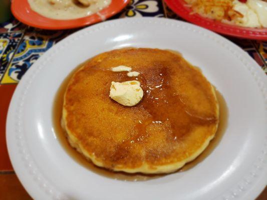 Cakey pancakes with whipped butter and warm syrup