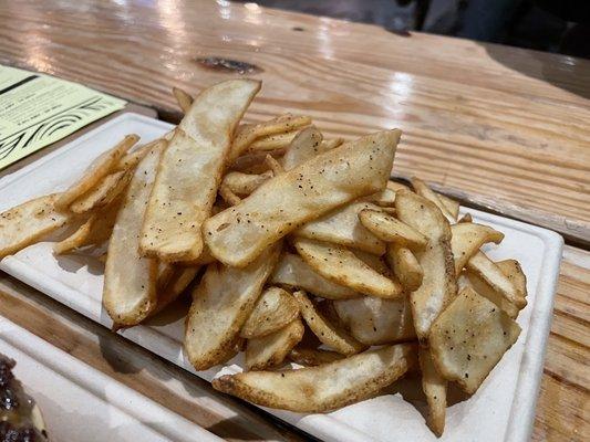 Basket of flat fries tossed in truffle salt - $11