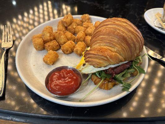 Break B.B. Egg and Cheese Sandwich with Crispy Potato Tots. The croissant makes it. Really good!