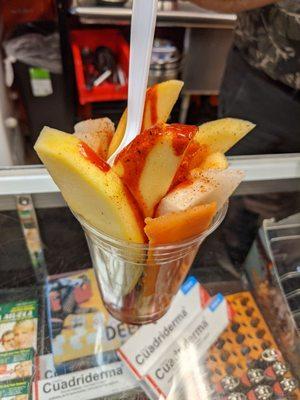 $5.00 fruit cup with mango, jicama and papaya.