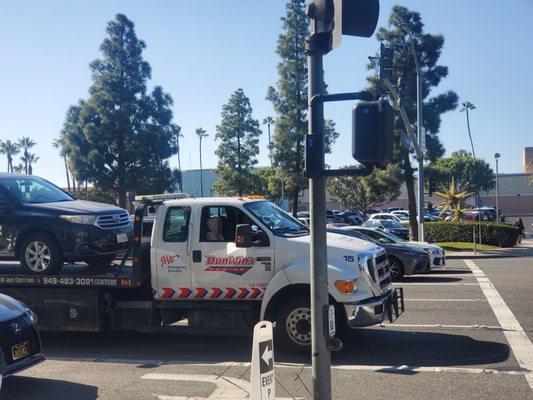 Two idiots driving for Dunivin's Towing decided to honk their very loud truck horn for about 3 seconds while we crossed.