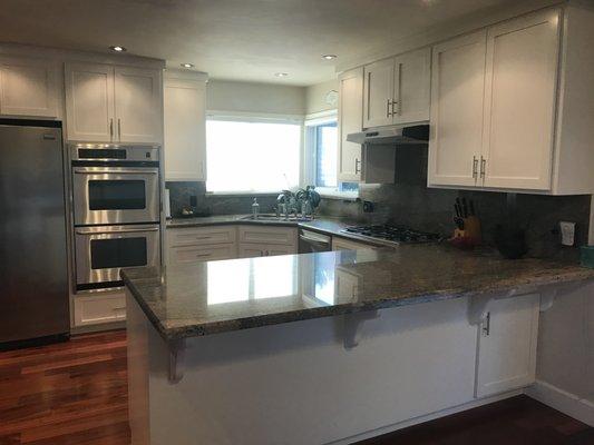 Cabinets after refacing. Lighter and brighter, the kitchen and dining area looked brand new.