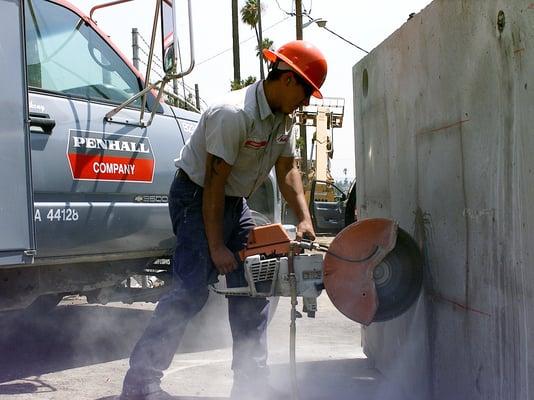 employee cutting concrete