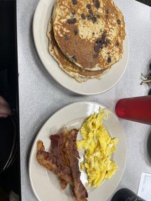 Lumberjack Jr with scrambled eggs, bacon, and chocolate chip pancakes