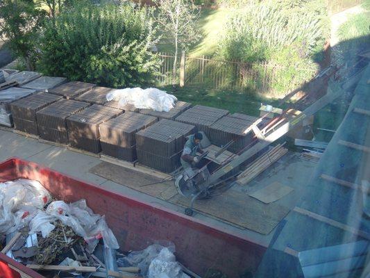 1 of the 2 trash dumpsters on my driveway. Also, the contraption to get the tiles up onto the roof.