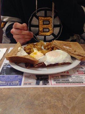 Two egg meal with hash, home fries, bread. Yum