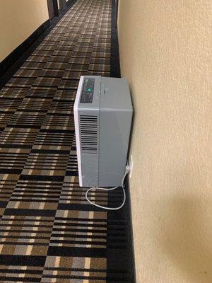 Dehumidifier outside of room