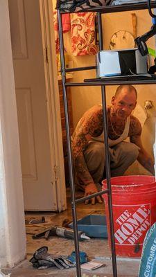 Jay Doing the Tile Grout to finish the Bathroom Jan 1 2021