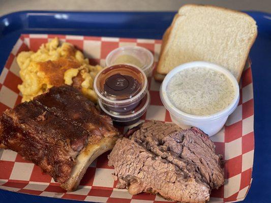 Sampler platter with baby back ribs, brisket, homemade Mac and cheese and coleslaw