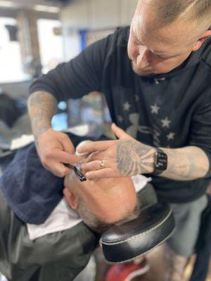 Barber Jim doing a hot towel straight razor shave