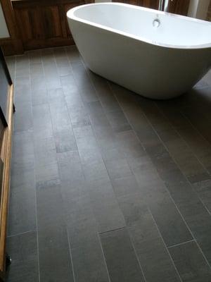 Porcelain 24x6 gray 
Grout: natural grey