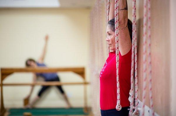 The rope wall really helps with stretching your shoulders and is a great way to get lumbar traction in certain poses.