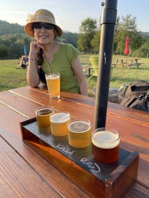 Mom modeling our flight of very impressive beer