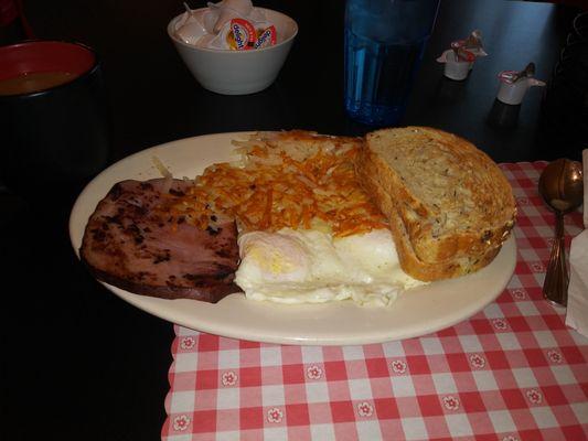 Ham and eggs with hashbrowns and sourdough toast.