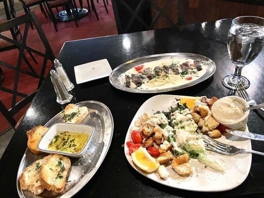 Garlic bread, Caesar Salad, Steak Alfredo pasta