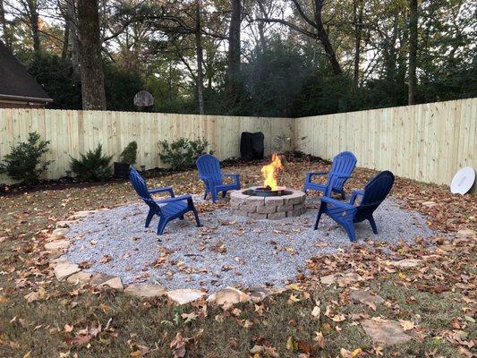 New fence and fire/conversation pit in reclaimed space where azaleas used to be.