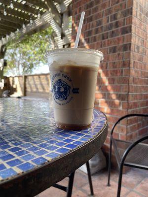 Iced Caramel Macchiato while sitting outside on the covered patio