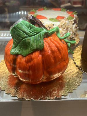 Pumpkin shaped chocolate buttercream cake with fondant icing. A great addition to your holiday meals.