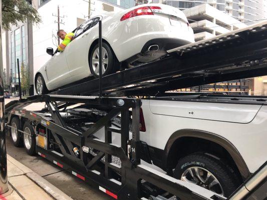 Igor driving the Jaguar on top of the transporter.