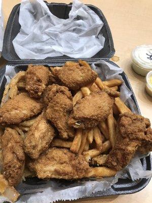 Chicken wing plate with fries and onion rings