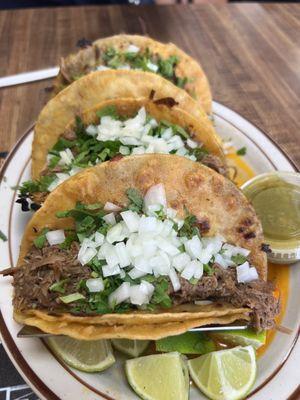 Birria tacos and consome