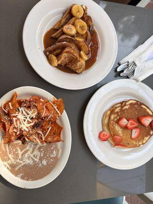 Chilaquiles , banana dulce de leche French toast, and strawberry pancakes