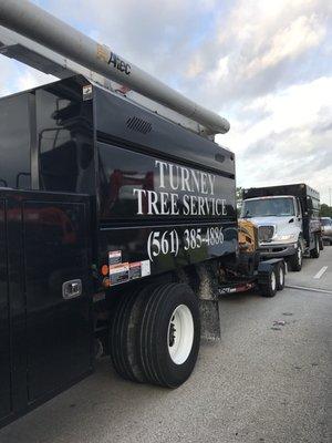 In heavy traffic, this work truck merged and side swiped my husband's car.