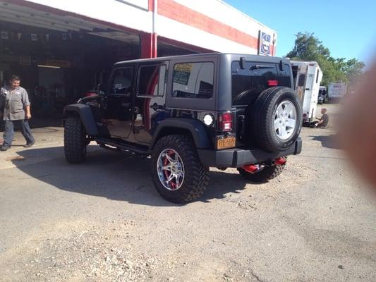 Jeep wrangler with new rims tires and painted calipers