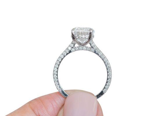 2.5ct Oval Moissanite in a tri-pave diamond encrusted setting