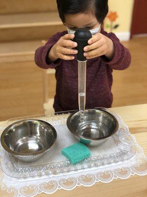 Transferring liquids in a bowl.