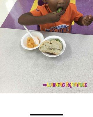 Casually eating broccoli and bread for lunch