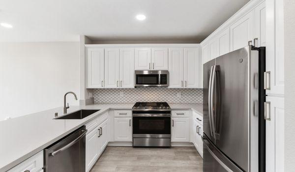 Enjoy mess-free living with stainless steel appliances and hardwood flooring!