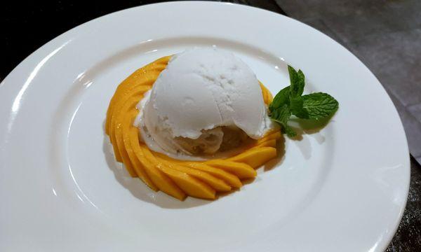 Mango, topped with Coconut Ice cream over jasmin rice.