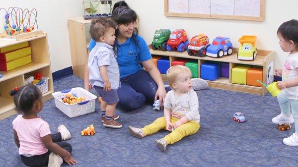 Teachers work closely with children to meet developmental milestones.