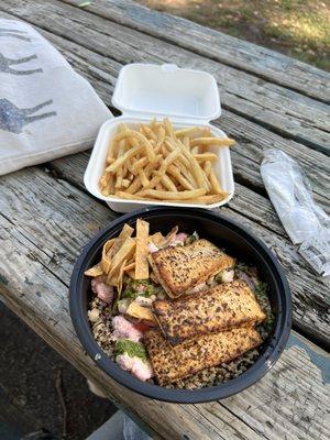 Vegan bowl with tofu and french fries on the side