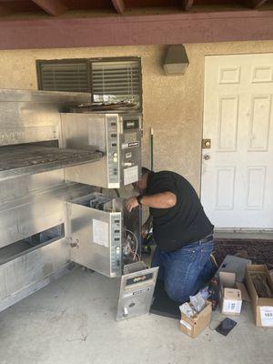 Eric servicing our pizza oven