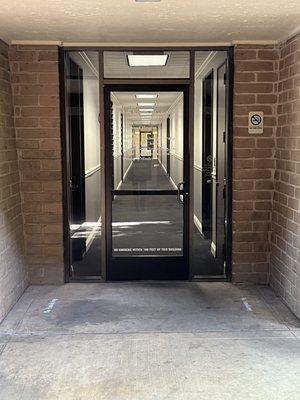 My office is down an interior corridor.  You can enter from both sides of the building.  Public bathrooms are at both ends as well.