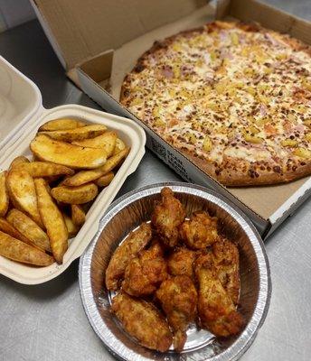 Family Pack #1  (1) large 2 topping pizza (10) wings hot or bbq (1lb) potato wedges (1) 2lt soda (2) ranch sides