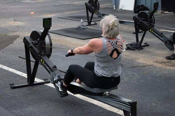 Member on rowing machine