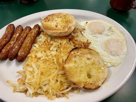 Eggs, hash browns, link sausages, and English muffin.