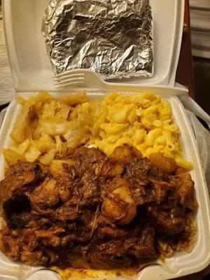 Oxtails, cabbage, mac n cheese, and a beef patty