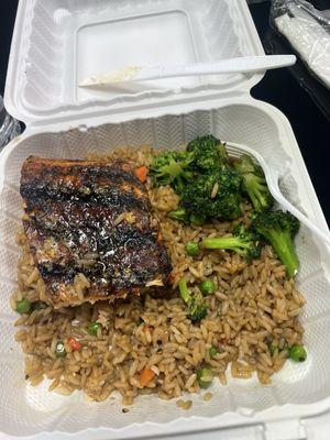 Half eaten hibachi salmon w/rice and broccoli