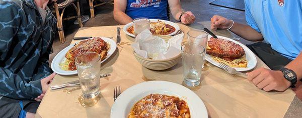 Gnocchi (bottom), chicken parmesan (left/right), and lasagna (top)